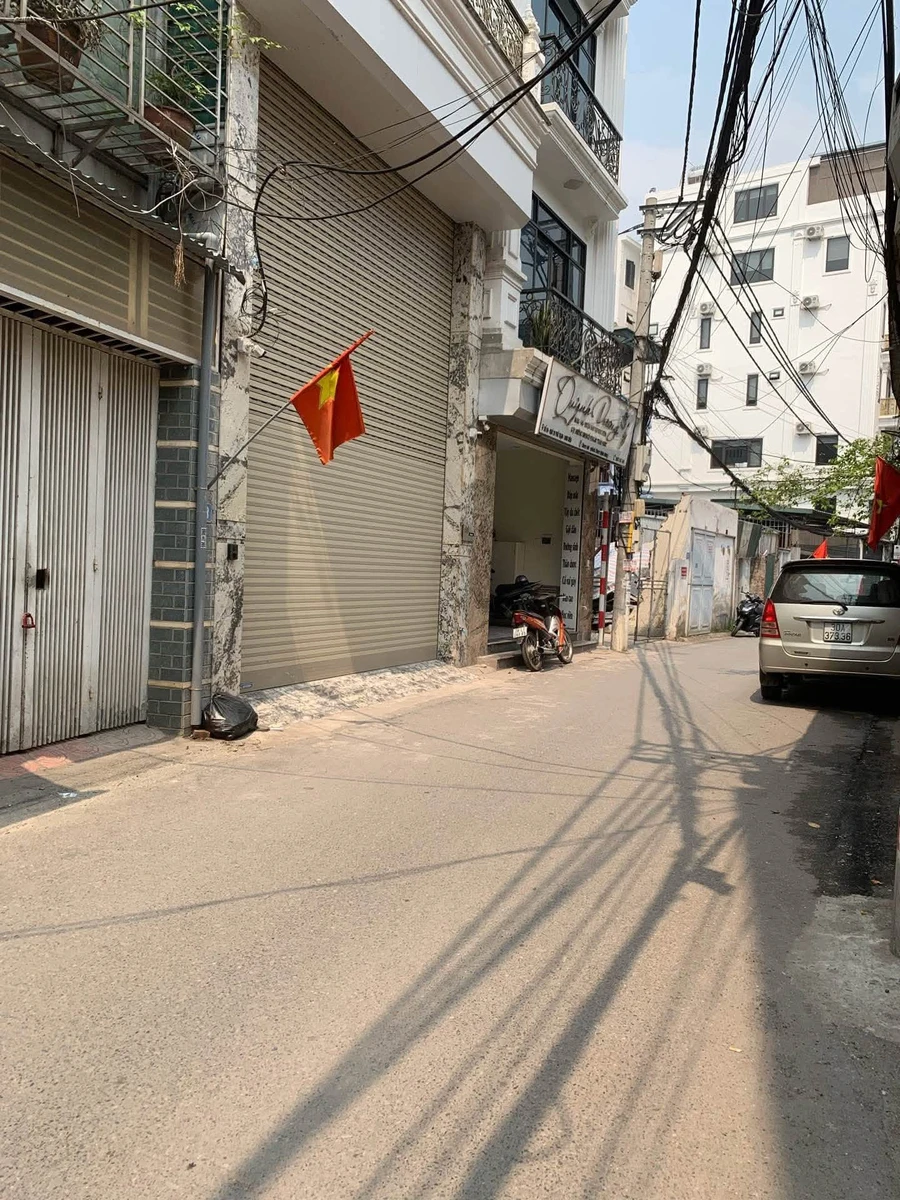 Bán nhà 8 tầng 89m2 phố Trạm, thang máy, gara 4 ô tô, giá 28 tỷ - Ảnh 1