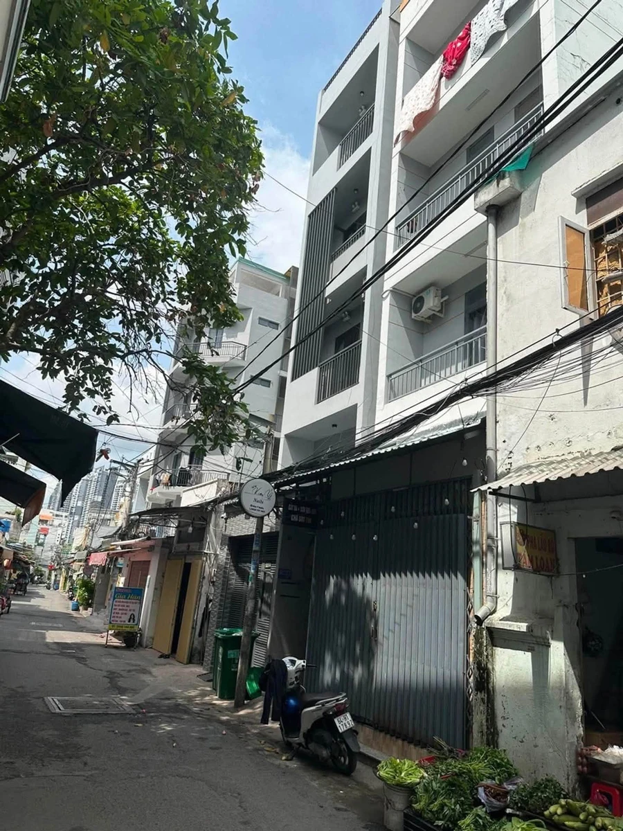 Bán nhà 4 tầng có sân thượng 110m² Quận 7 - Ảnh 1